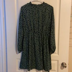 Green dress with black polka dots